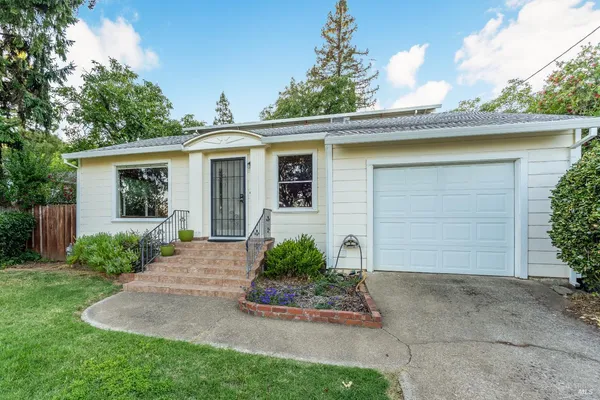 front view of a house with a yard