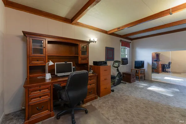 a view of a workspace with furniture