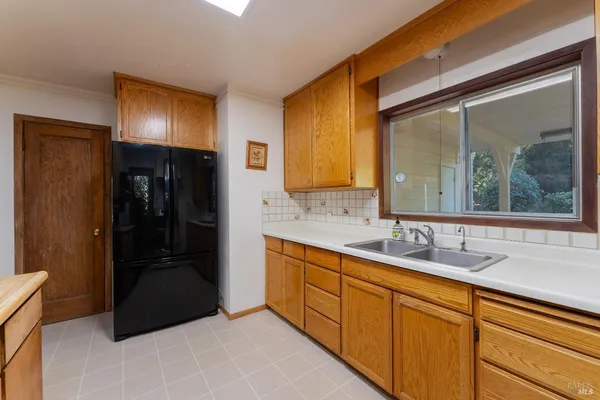 a bathroom with a double vanity sink and mirror