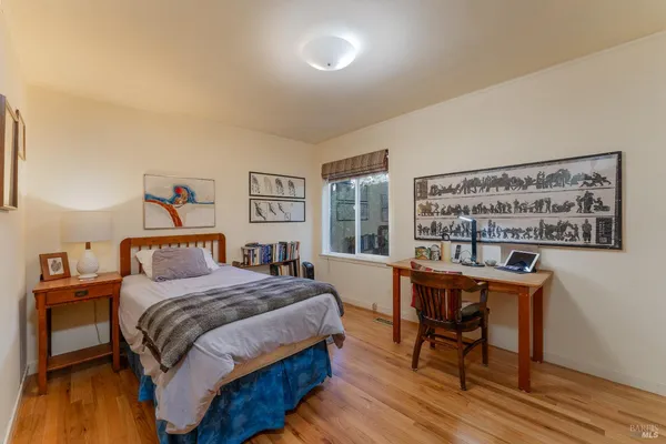 a bedroom with a bed and a table in it