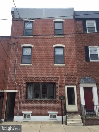 a front view of a building with multiple windows
