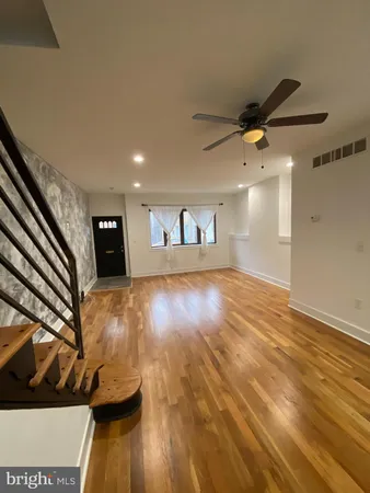 a view of a livingroom with wooden floor