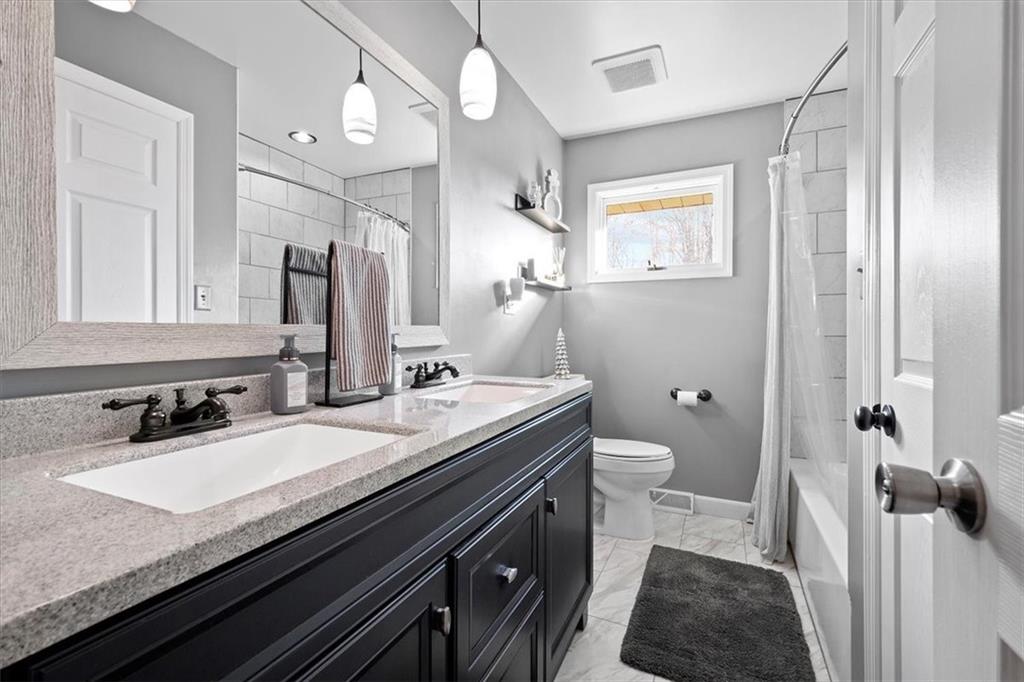318 Holyoke Road Butler, PA 16001 - Photo 12 of 25 a bathroom with a granite countertop sink toilet and shower