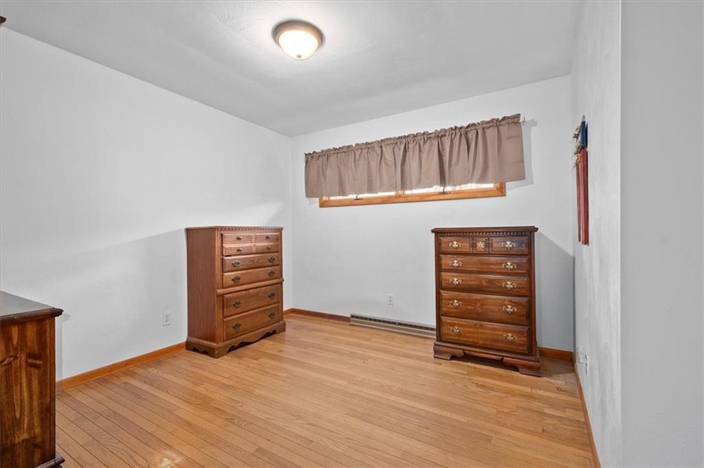 318 Holyoke Road Butler, PA 16001 - Photo 13 of 25 an empty room with wooden floor and closet