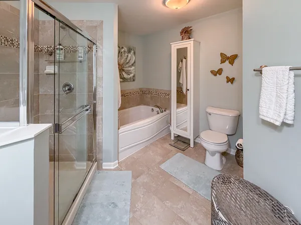 a bathroom with a toilet a sink and bathtub