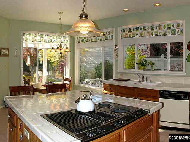 4042 Caughlin Creek Road Reno, NV 89519 - Photo 4 of 9 a kitchen with a stove and a view of living room