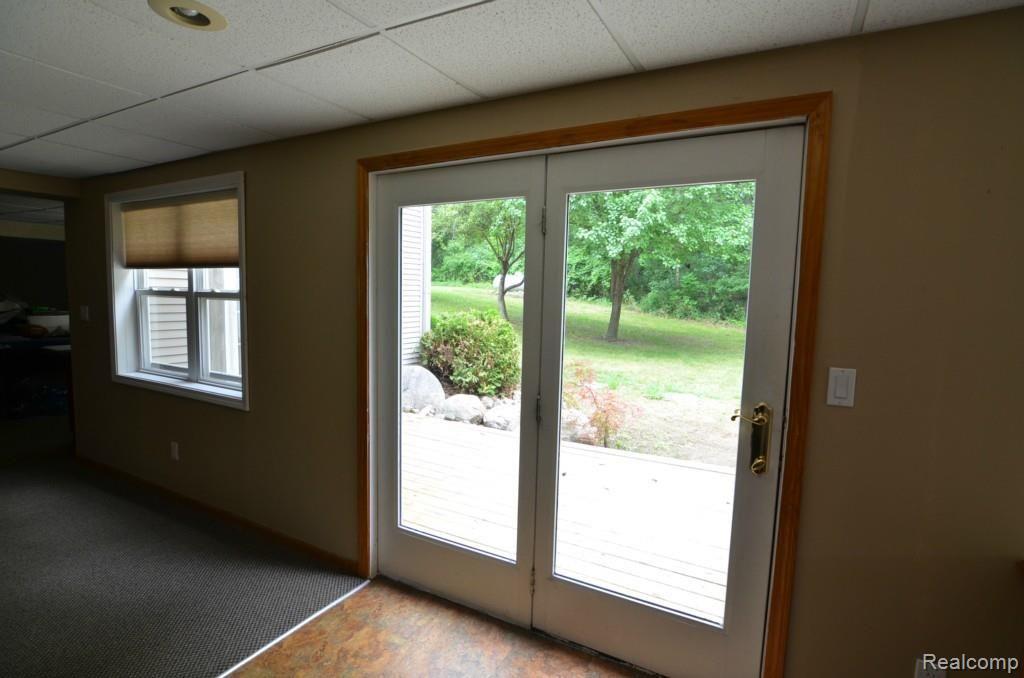 8620 Eaton Road Davisburg, MI 48350 - Photo 32 of 55 LOWER LEVEL WALK OUR TO DECK AND POOL AREA