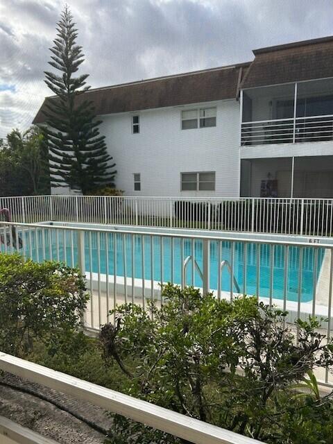 10330 North Military Trail, Unit 6A Palm Beach Gardens, FL 33410 - Photo 11 of 11 a view of a house with a fence