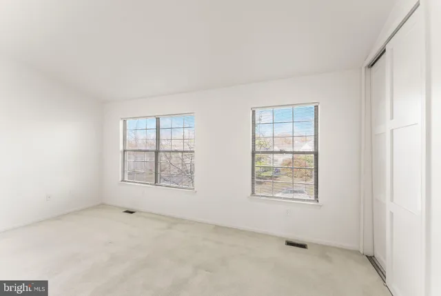 an empty room with windows
