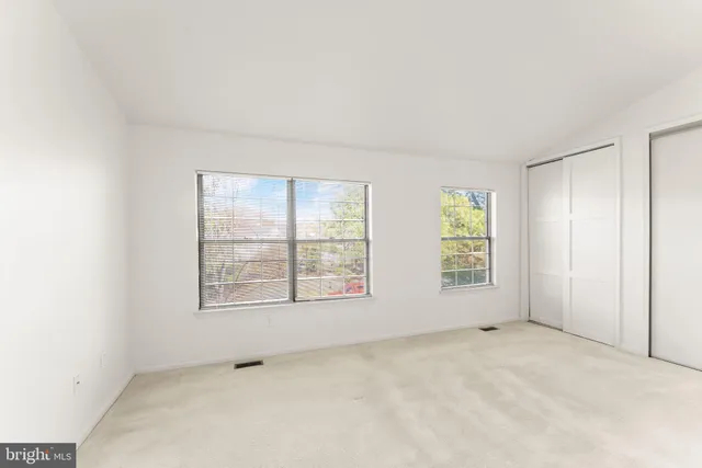 an empty room with windows