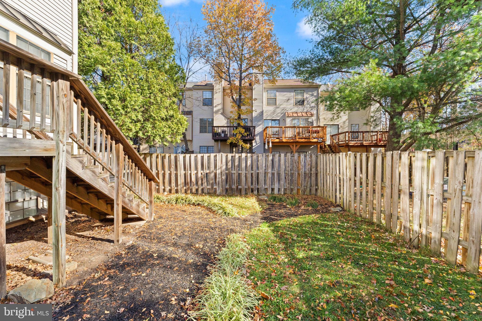 6001 Little Brook Court Clifton, VA 20124 - Photo 36 of 46 a view of a house with a small yard and wooden fence