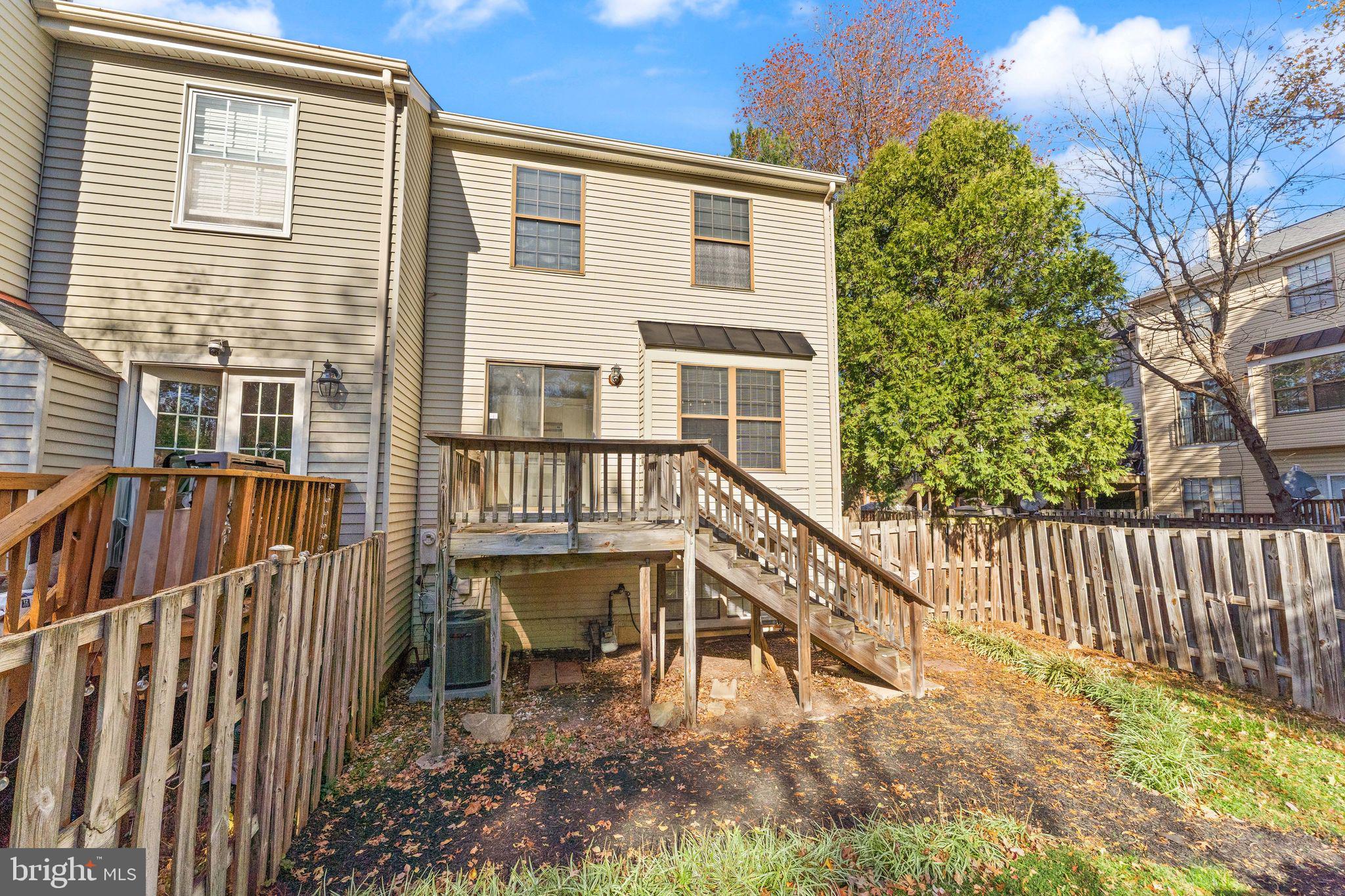 6001 Little Brook Court Clifton, VA 20124 - Photo 37 of 46 a view of a house with a small deck and furniture