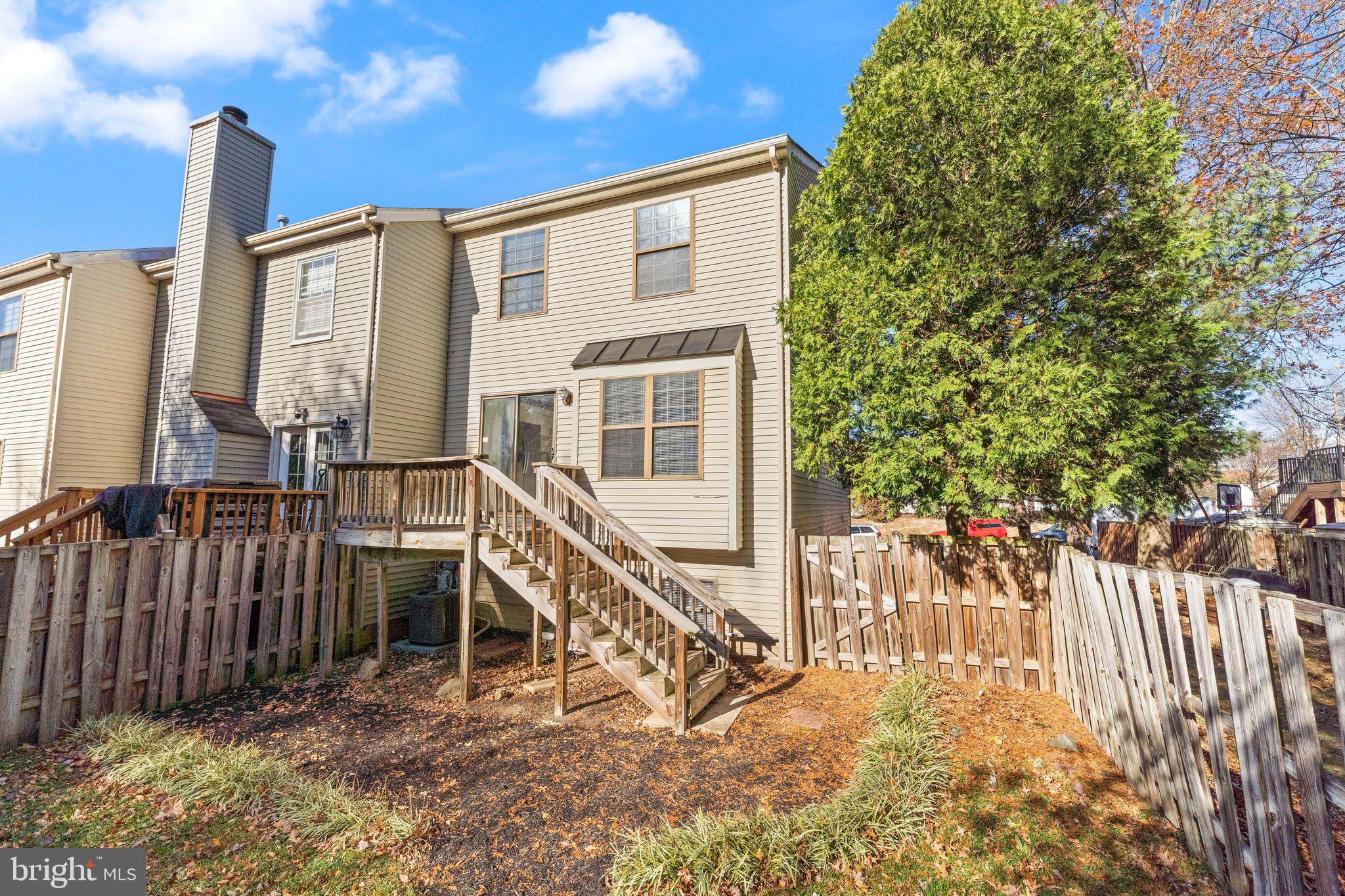6001 Little Brook Court Clifton, VA 20124 - Photo 40 of 46 a view of a house with a wooden fence