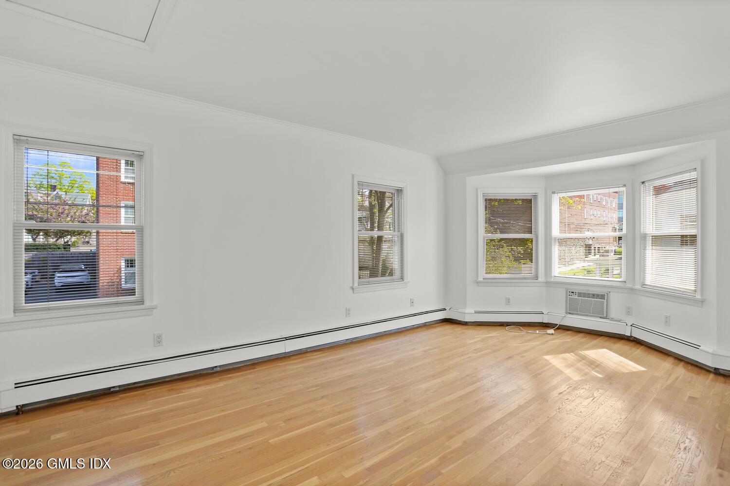 22 Grigg Street, Unit 2 Greenwich, CT 06830 - Photo 3 of 11 a view of empty room with wooden floor and fan