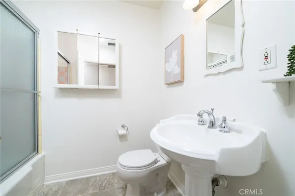 a bathroom with a sink and a toilet