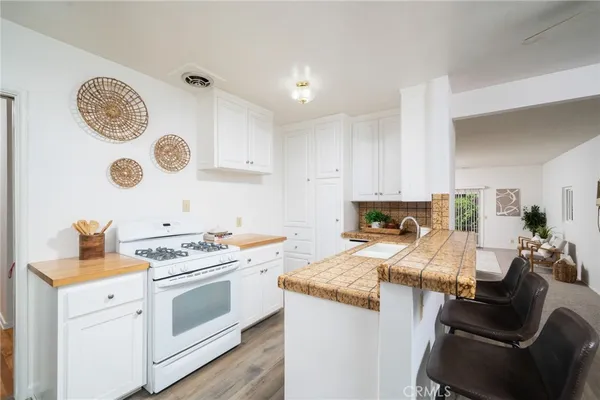 a kitchen with a stove and a table