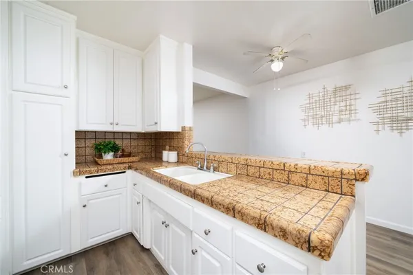 a kitchen with a sink and cabinets
