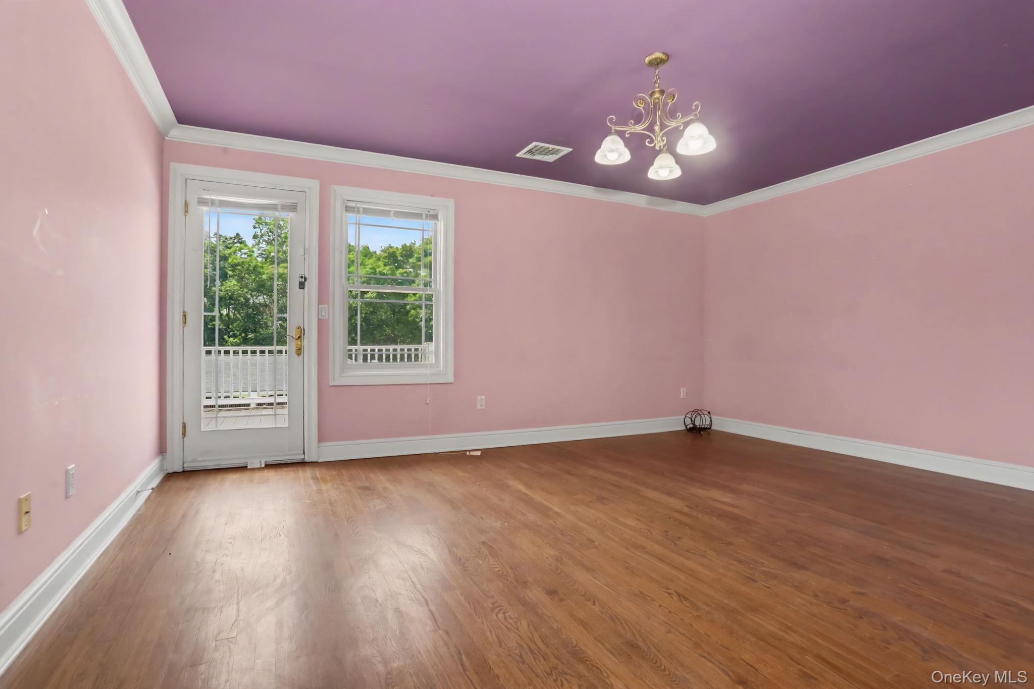 33 Manor Road Patterson, NY 12563 - Photo 20 of 37 a view of an empty room with wooden floor and a window