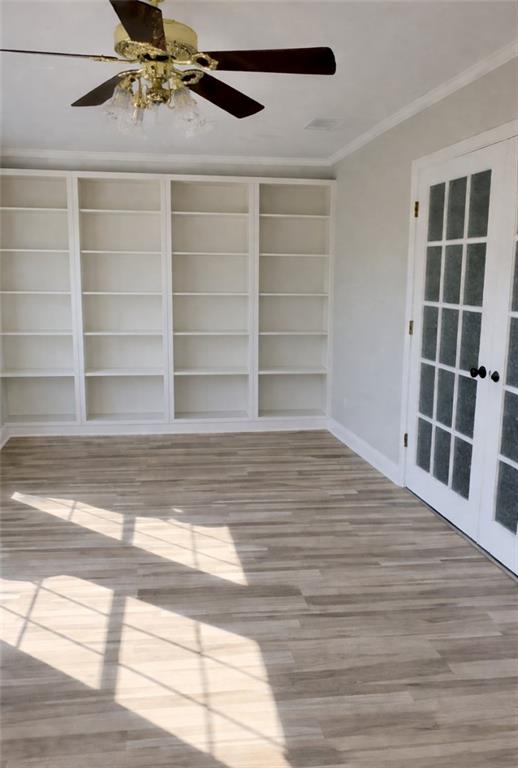 1833 Tom Odum Road Vidalia, GA 30474 - Photo 17 of 59 a view of a room with wooden floor and windows