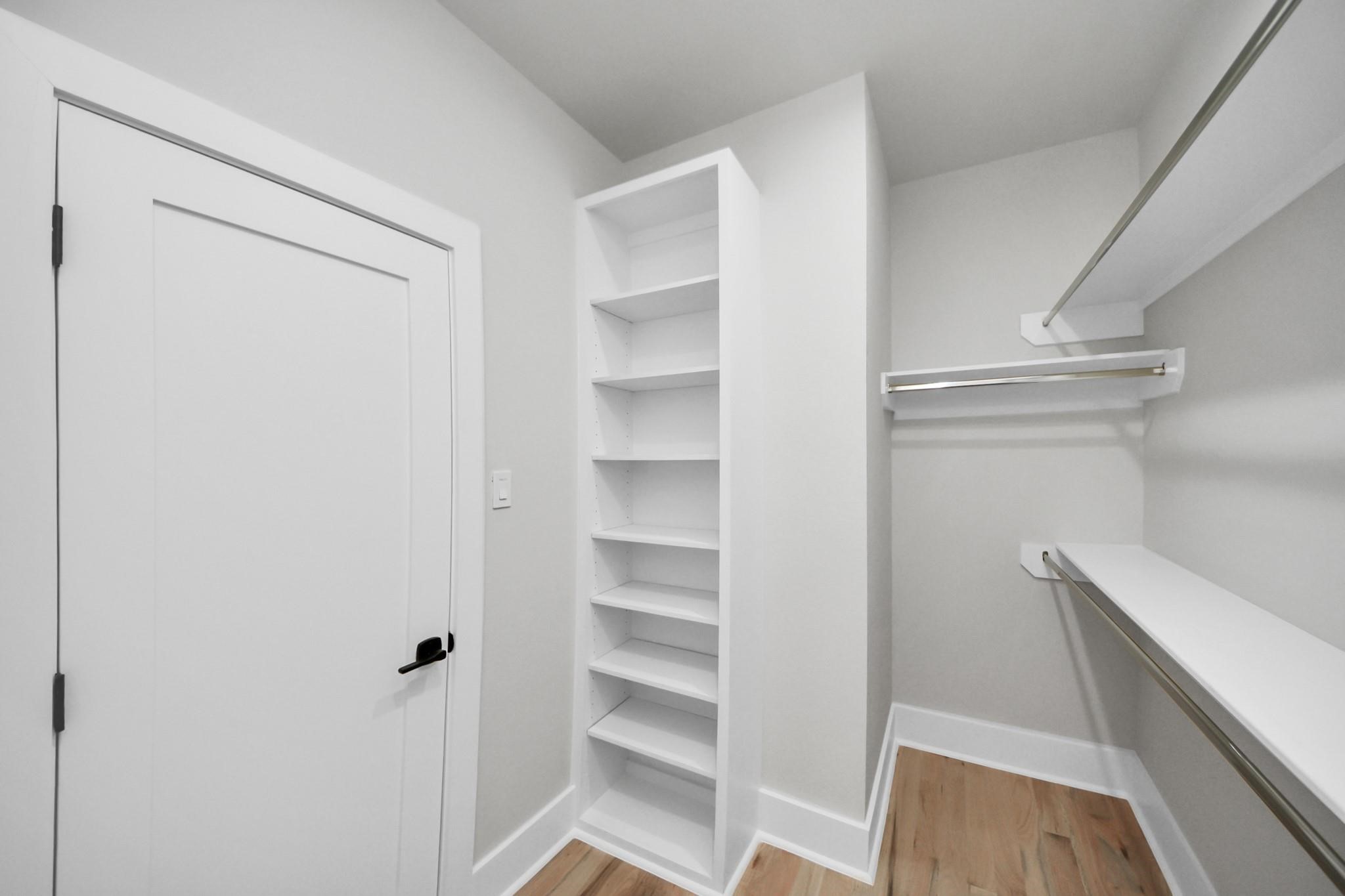 6320 Milwee Street, Unit B Houston, TX 77092 - Photo 24 of 30 a view of walk in closet with empty racks