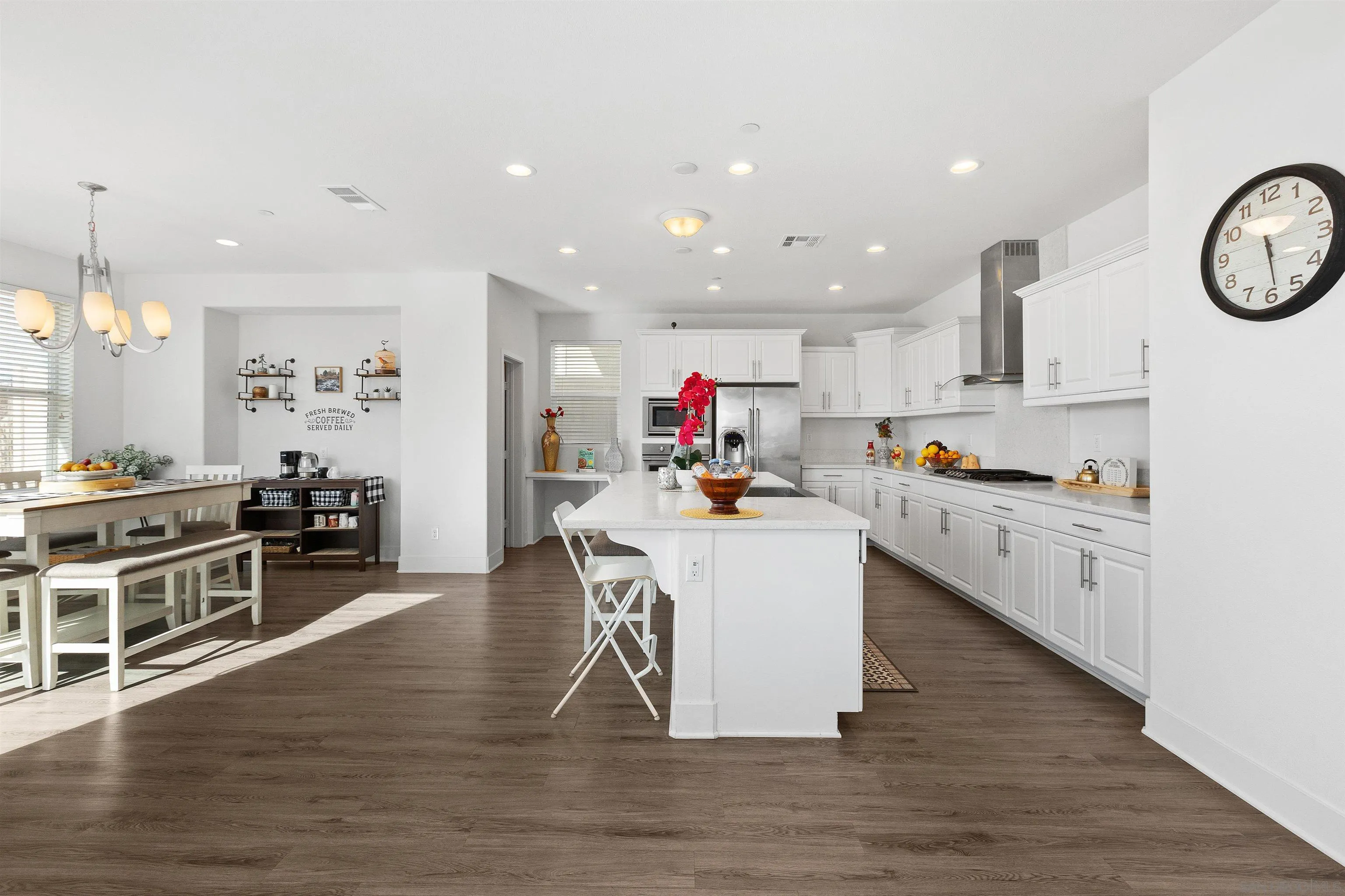 35732 Garrano Lane Fallbrook, CA 92028 - Photo 12 of 44 a kitchen that has a lot of cabinets a sink and appliances in it