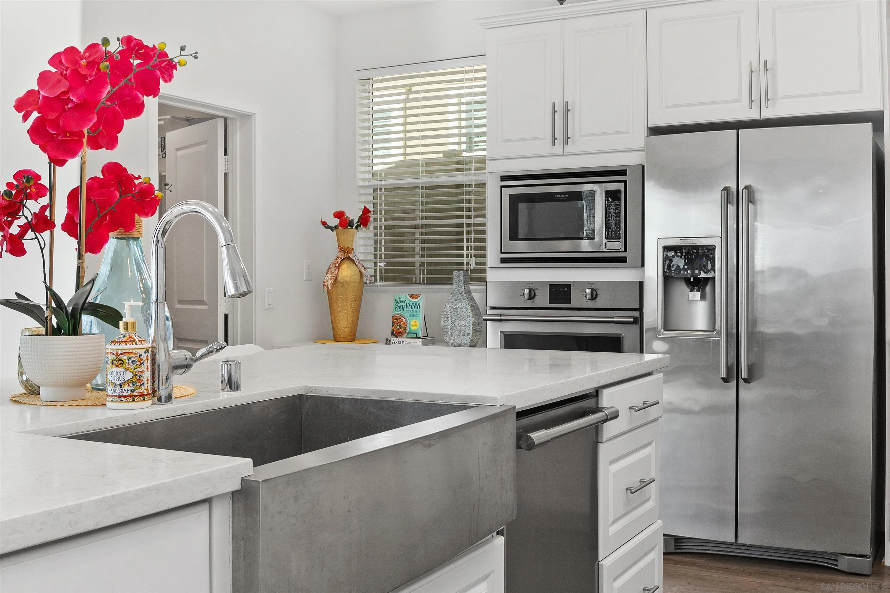 35732 Garrano Lane Fallbrook, CA 92028 - Photo 19 of 44 a kitchen with a sink and refrigerator