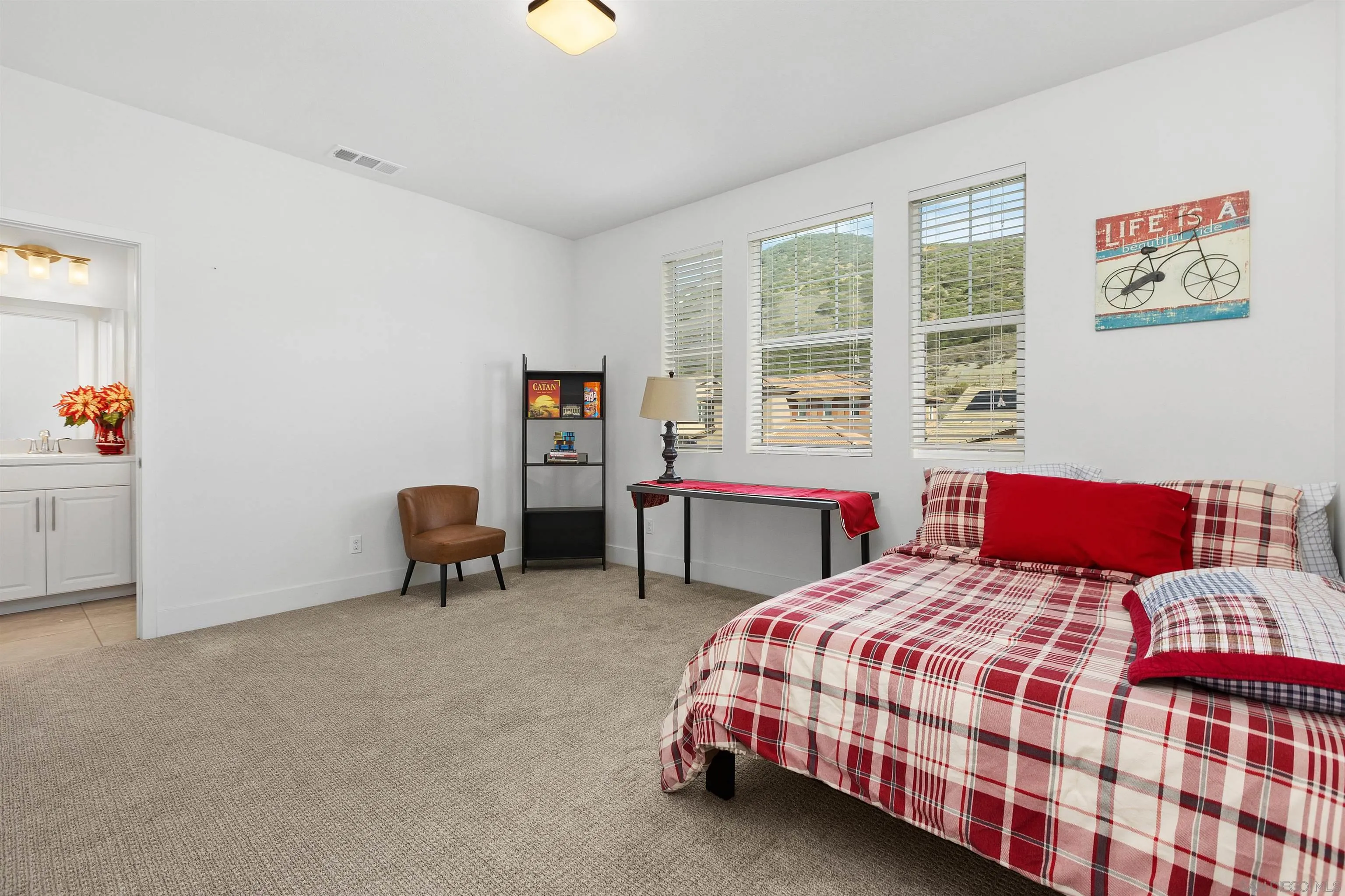 35732 Garrano Lane Fallbrook, CA 92028 - Photo 25 of 44 a bedroom with two beds and a window