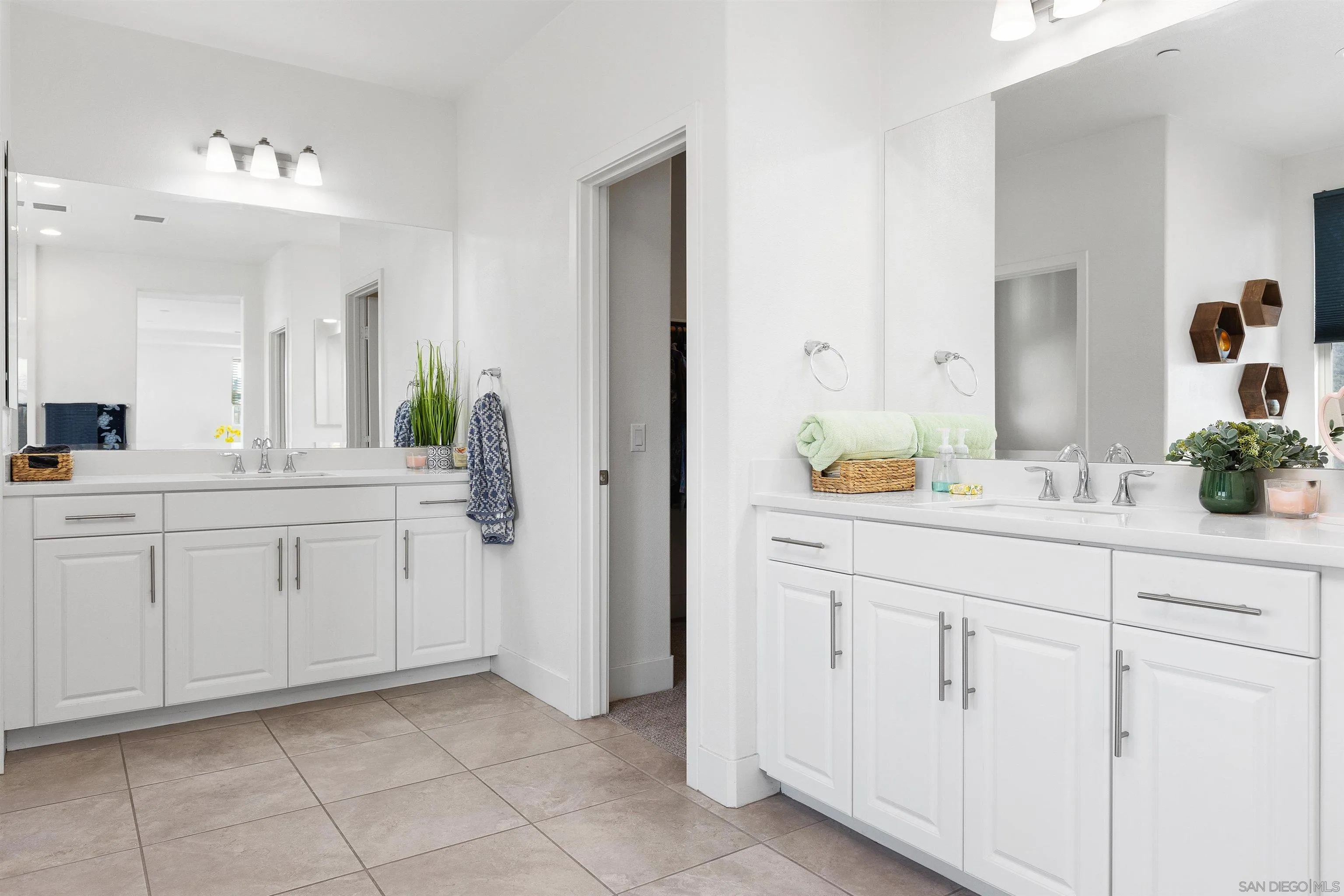35732 Garrano Lane Fallbrook, CA 92028 - Photo 31 of 44 a spacious bathroom with a double vanity sink and a mirror