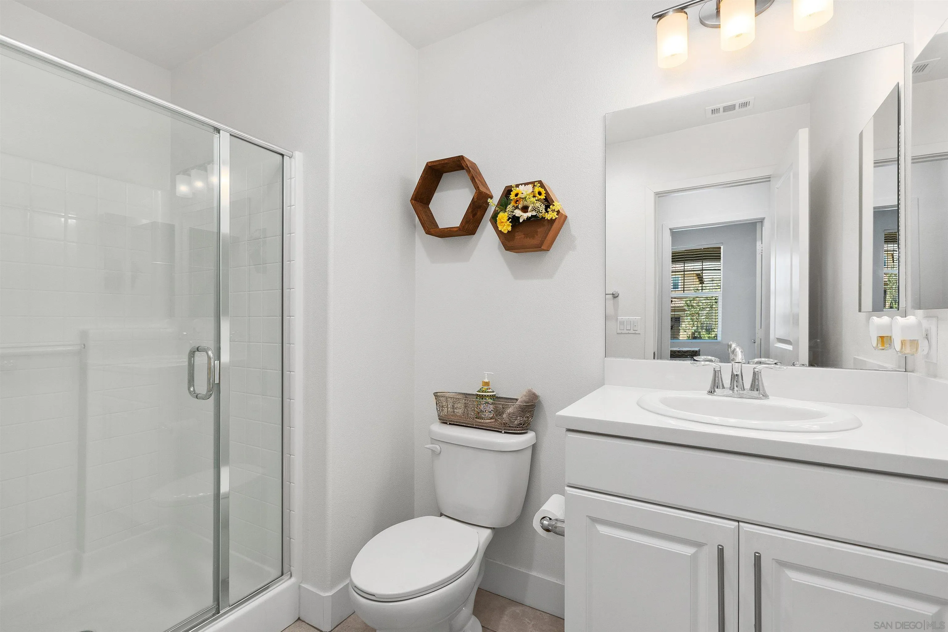 35732 Garrano Lane Fallbrook, CA 92028 - Photo 4 of 44 a bathroom with a sink mirror toilet and vanity