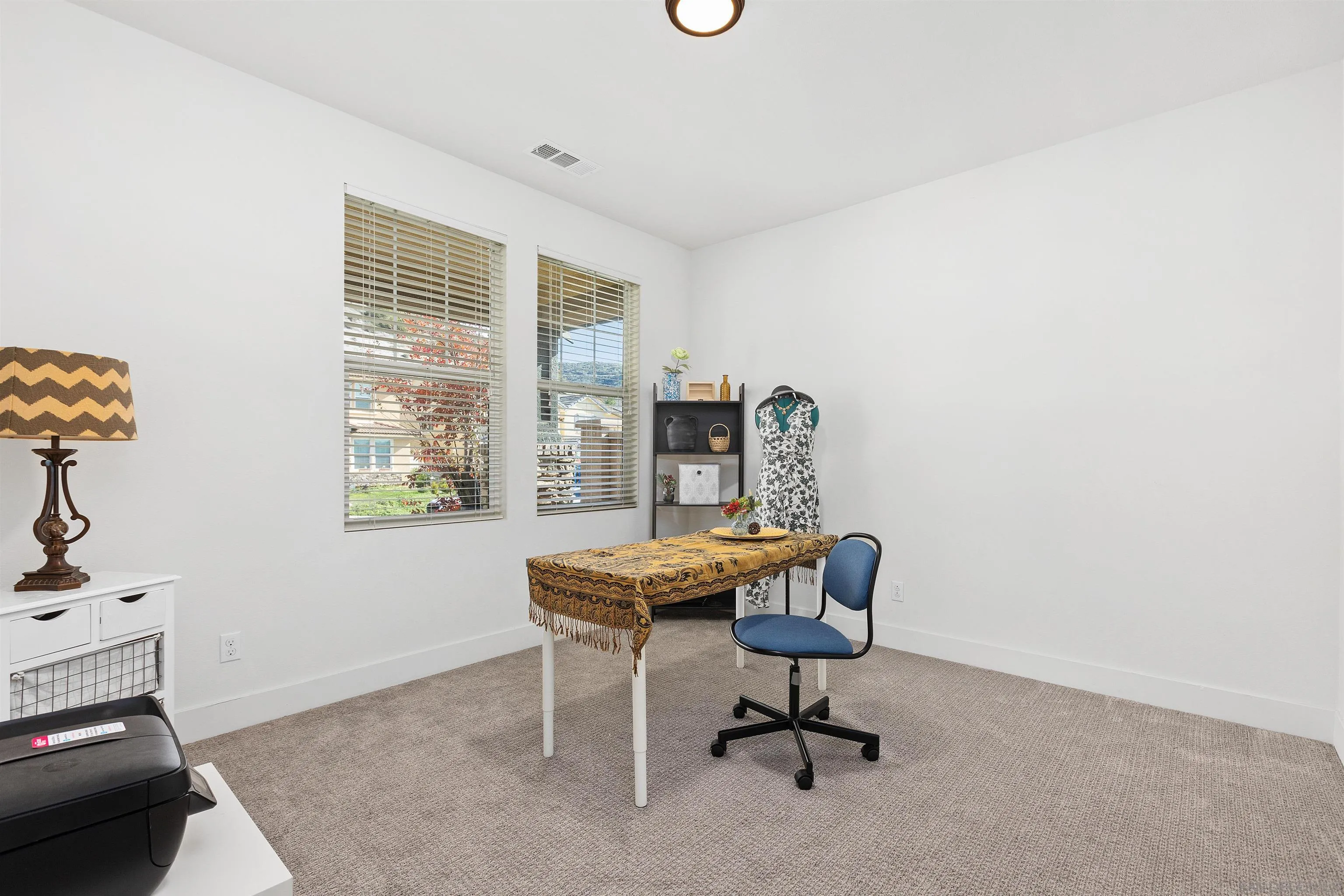 35732 Garrano Lane Fallbrook, CA 92028 - Photo 5 of 44 a work room with furniture and windows