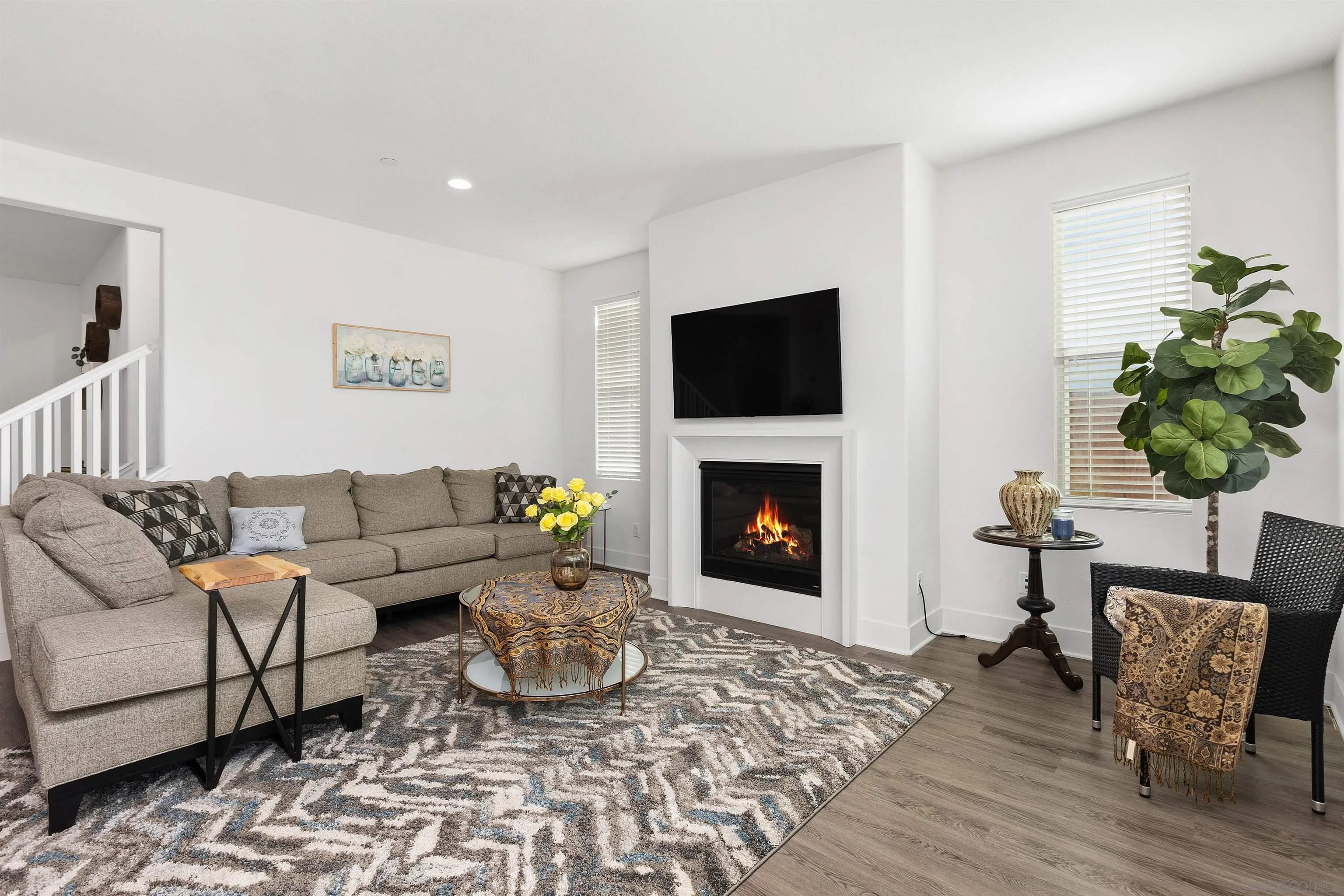 35732 Garrano Lane Fallbrook, CA 92028 - Photo 10 of 44 a living room with furniture a flat screen tv and a fireplace