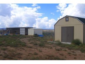 7707 East Irwin Ranch Road Prescott Valley, AZ 86315 - Photo 11 of 12 a front view of a house with a yard