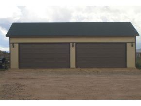 7707 East Irwin Ranch Road Prescott Valley, AZ 86315 - Photo 2 of 12 a black white building with a field