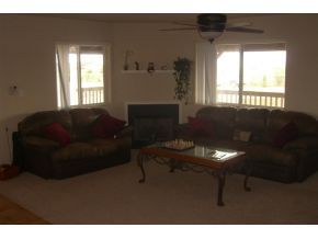 7707 East Irwin Ranch Road Prescott Valley, AZ 86315 - Photo 5 of 12 a living room with furniture and a window
