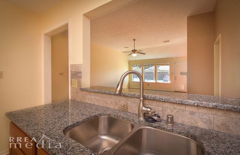 19723 Glenfinch Lane Spring, TX 77379 - Photo 11 of 39 Kitchen is open to living room