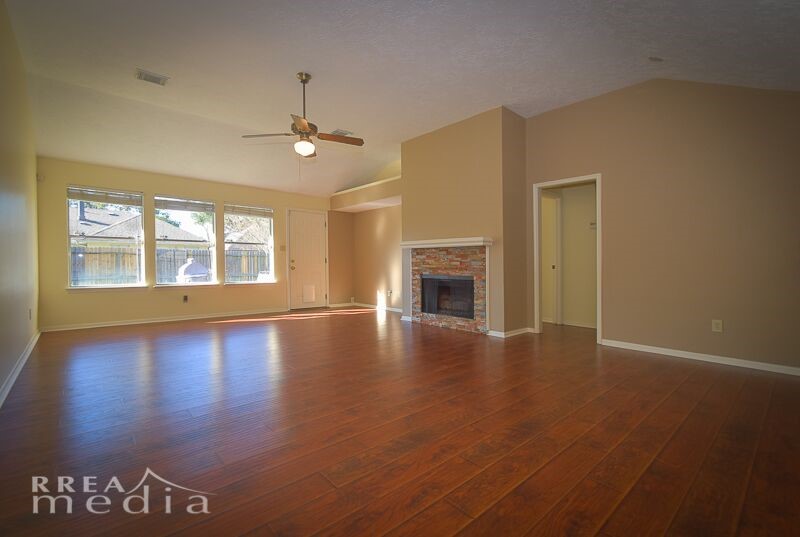 19723 Glenfinch Lane Spring, TX 77379 - Photo 3 of 39 Large living area with stone gas log fireplace