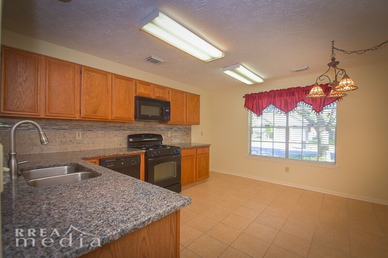 19723 Glenfinch Lane Spring, TX 77379 - Photo 8 of 39 Kitchen has granite counter tops