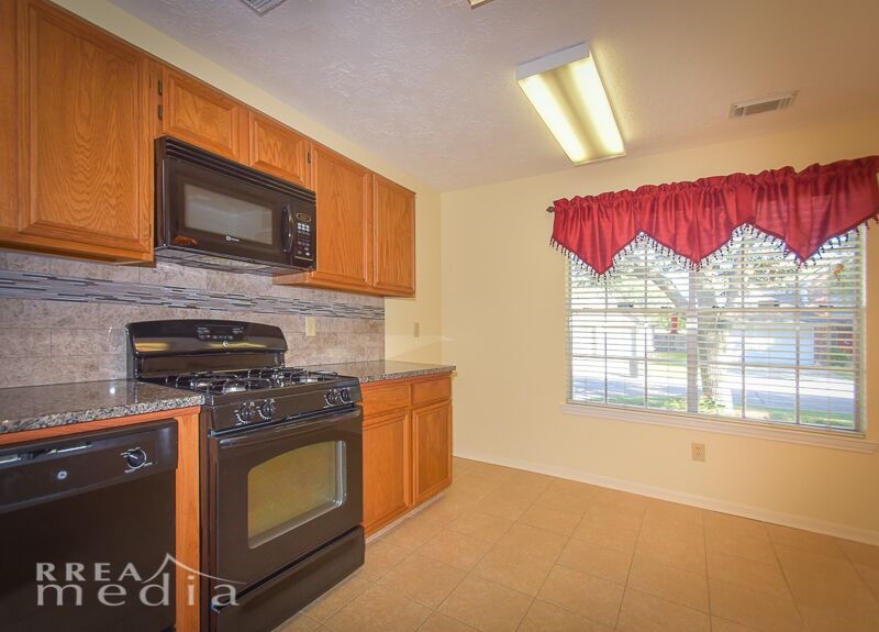 19723 Glenfinch Lane Spring, TX 77379 - Photo 9 of 39 Built in microwave with gas cook top