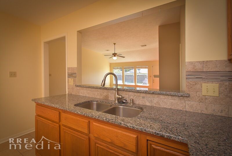 19723 Glenfinch Lane Spring, TX 77379 - Photo 10 of 39 Kitchen looks out into living room