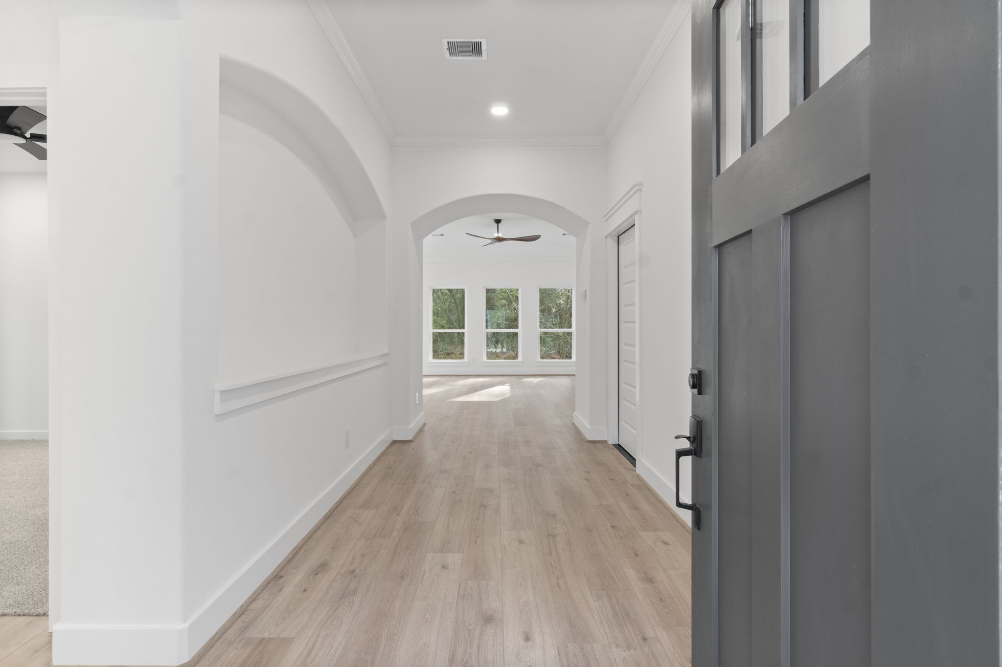 241 Clear Springs Trinity, TX 75862 - Photo 5 of 46 a view of a hallway with wooden floor and a window