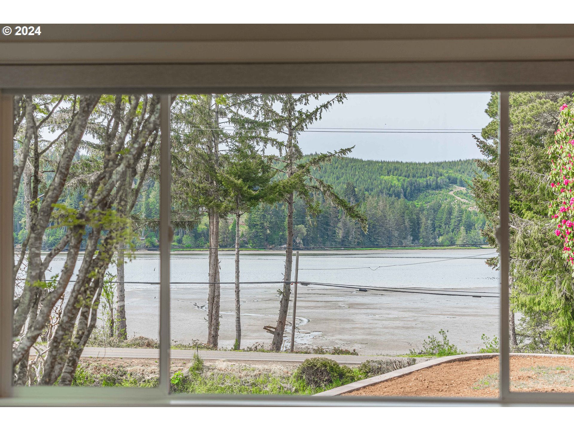 66013 North Bay Road North Bend, OR 97459 - Photo 12 of 48 a view of a porch with a yard
