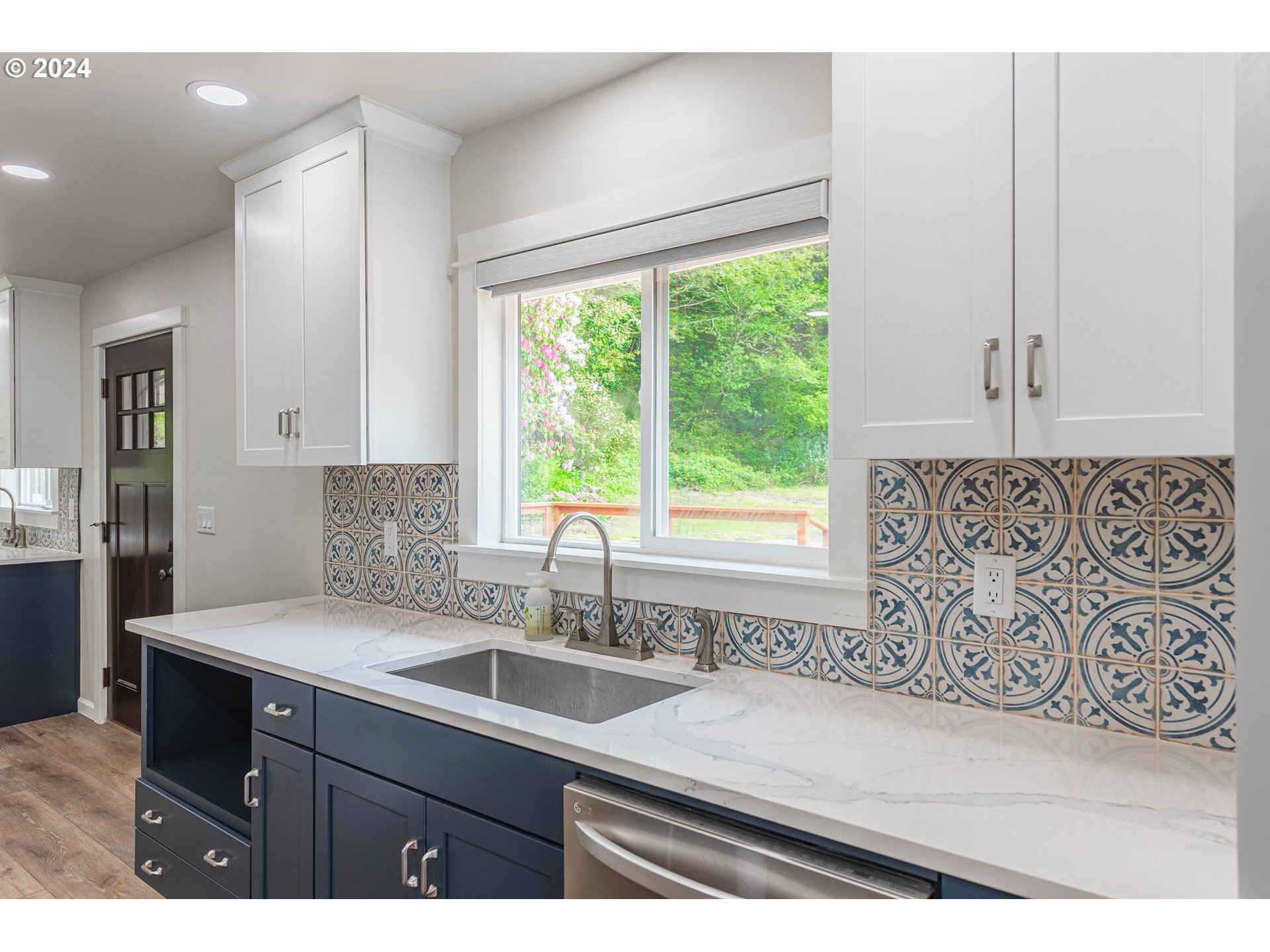 66013 North Bay Road North Bend, OR 97459 - Photo 16 of 48 a kitchen with a sink and large window
