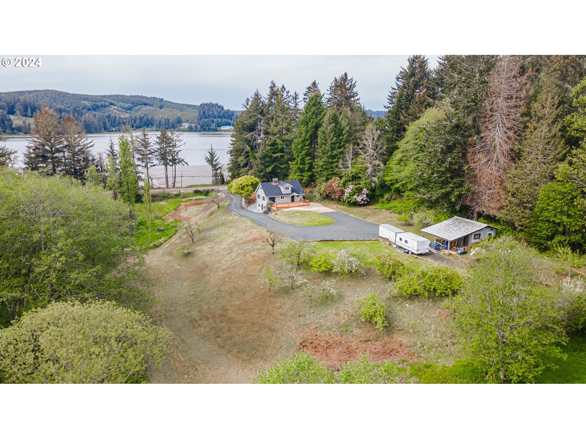 66013 North Bay Road North Bend, OR 97459 - Photo 2 of 48 a black and white photo of a house