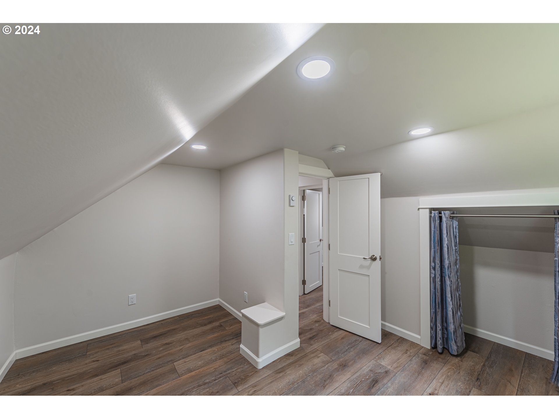 66013 North Bay Road North Bend, OR 97459 - Photo 27 of 48 a view of an empty room with closet and a window
