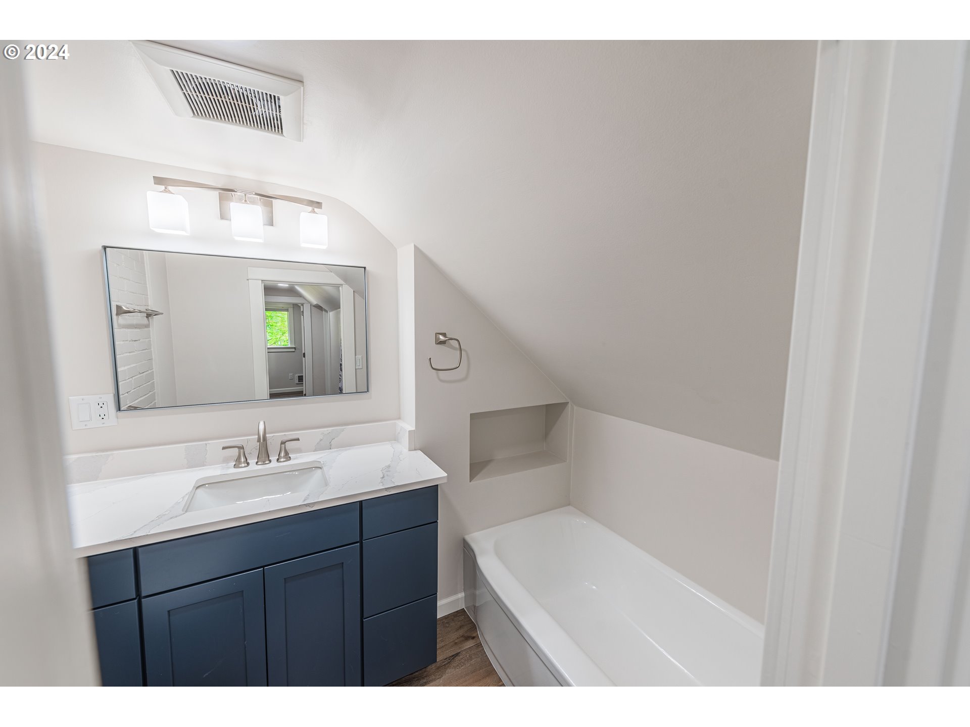 66013 North Bay Road North Bend, OR 97459 - Photo 28 of 48 a bathroom with a sink and a mirror