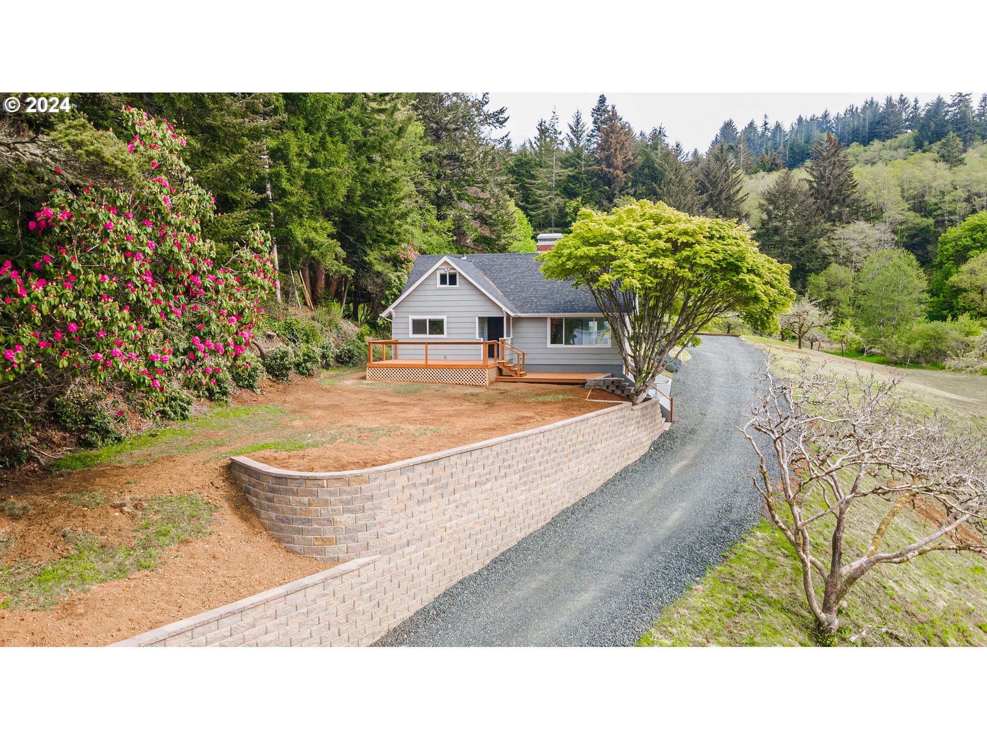 66013 North Bay Road North Bend, OR 97459 - Photo 3 of 48 a balcony with table and chairs