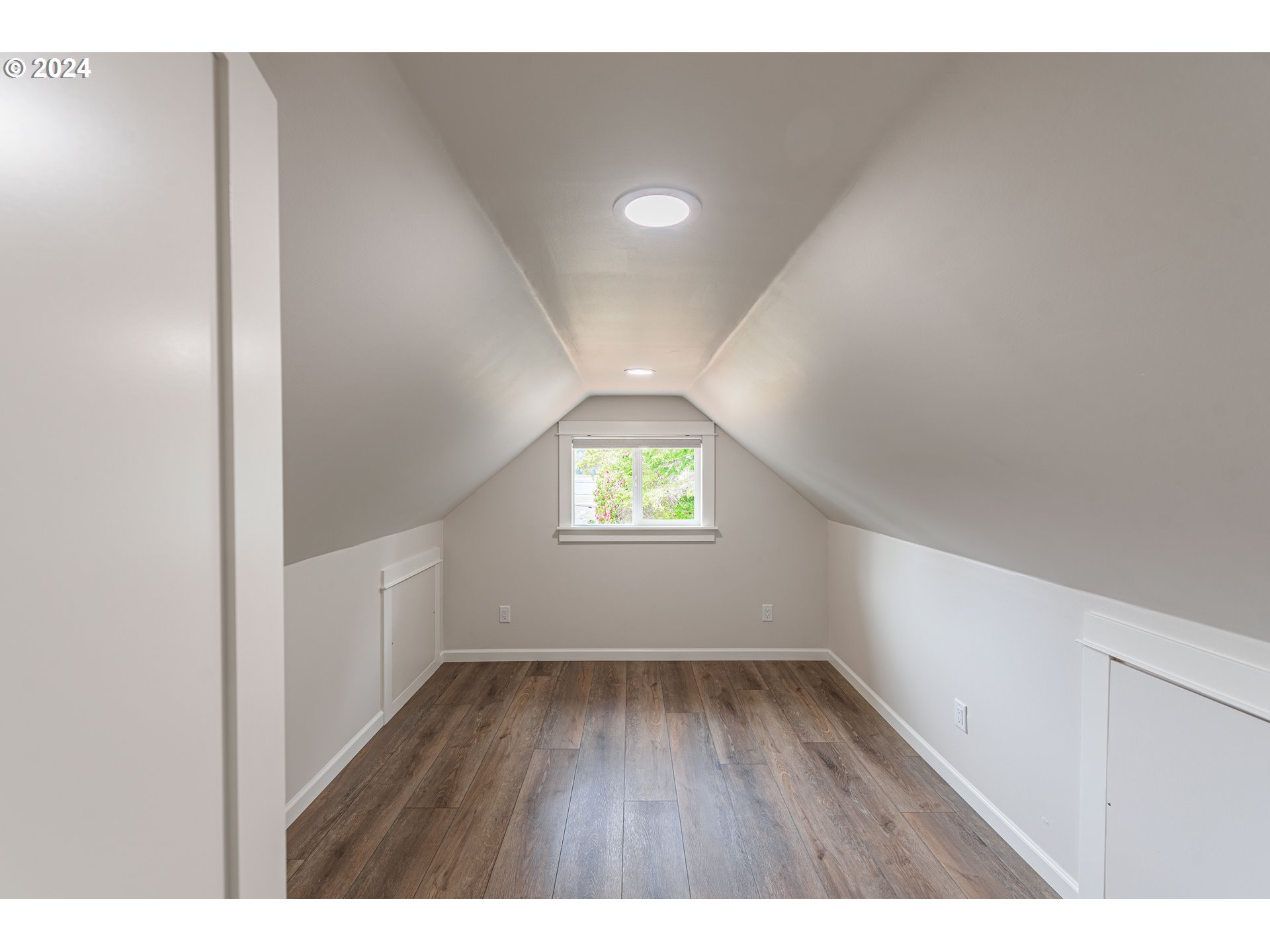 66013 North Bay Road North Bend, OR 97459 - Photo 31 of 48 a view of an empty room with wooden floor and a window