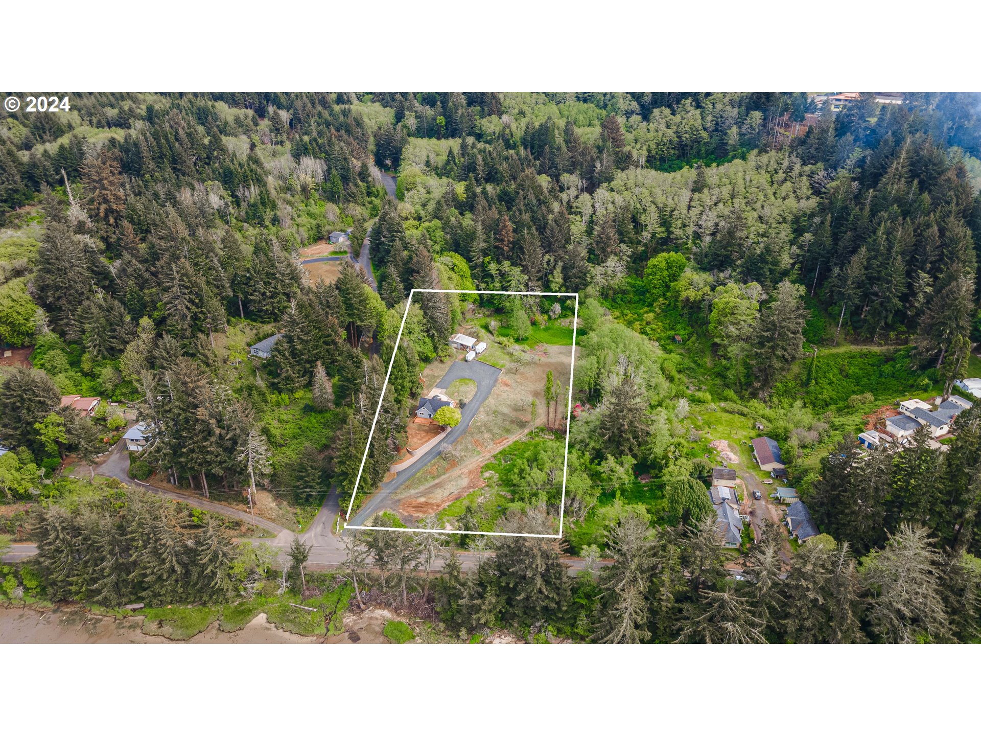 66013 North Bay Road North Bend, OR 97459 - Photo 48 of 48 a view of a backyard