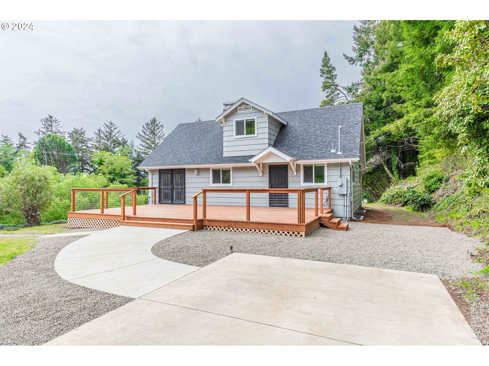 66013 North Bay Road North Bend, OR 97459 - Photo 7 of 48 front view of a house with a patio