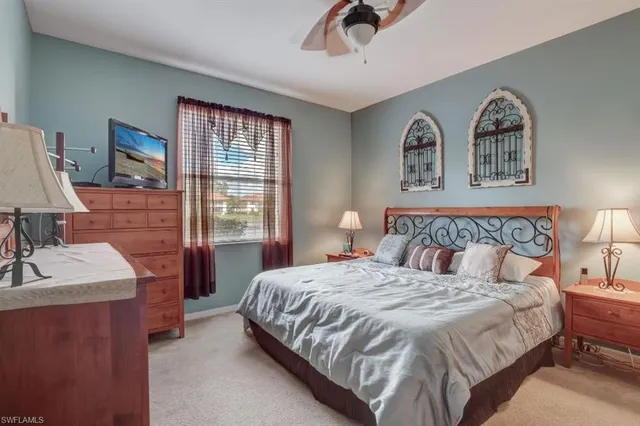 a bedroom with a bed and a dresser